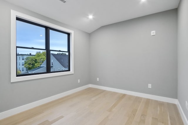 spare room featuring light wood-type flooring