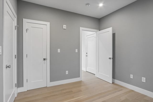 unfurnished bedroom featuring light hardwood / wood-style flooring