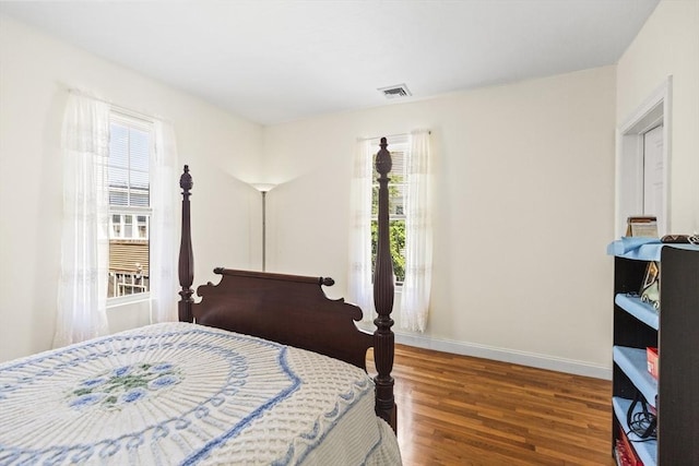 4-6 Marcella St Unit 2, Boston, MA 02119 - bedroom with wood finished floors, multiple windows, and baseboards