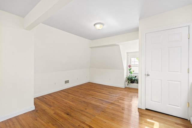 4-6 Marcella St Unit 2, Boston, MA 02119 - spare room with light wood-style flooring, baseboards, and beamed ceiling