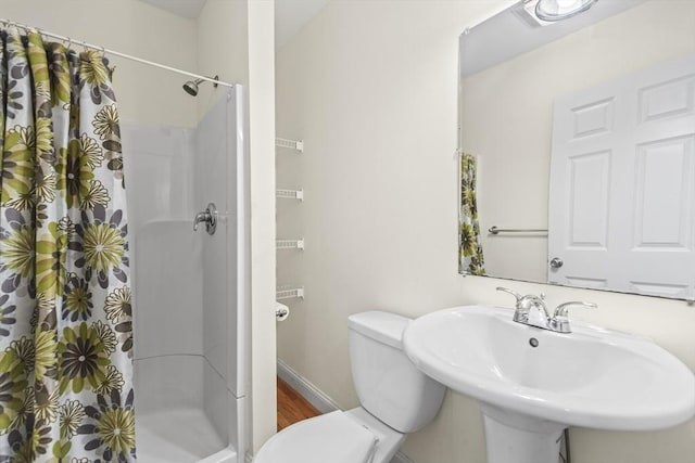 4-6 Marcella St Unit 2, Boston, MA 02119 - bathroom featuring toilet, a shower stall, and a sink