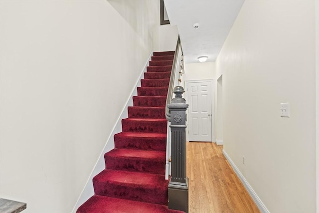 4-6 Marcella St Unit 2, Boston, MA 02119 - stairway featuring wood finished floors and baseboards