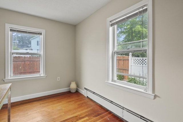 0 Steeple View Way, Leominster, MA 01453 - empty room featuring a baseboard heating unit, healthy amount of natural light, and light wood-style floors