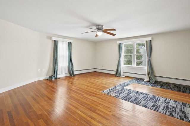 0 Steeple View Way, Leominster, MA 01453 - unfurnished room featuring ceiling fan, wood finished floors, and a baseboard heating unit