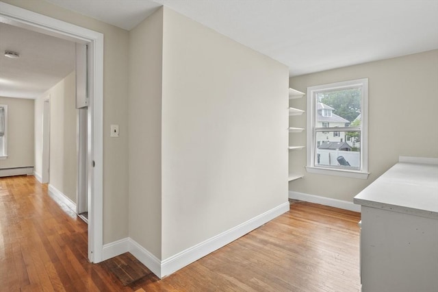 0 Steeple View Way, Leominster, MA 01453 - hallway with light wood finished floors and a baseboard radiator