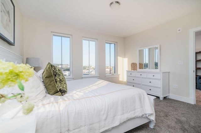 carpeted bedroom with baseboards