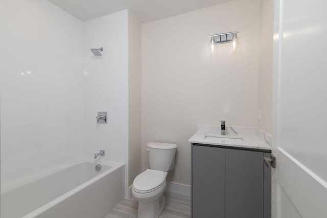 full bathroom featuring toilet, shower / bath combination, baseboards, and vanity