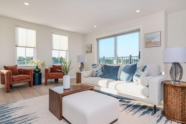 living area featuring light wood-style floors and recessed lighting