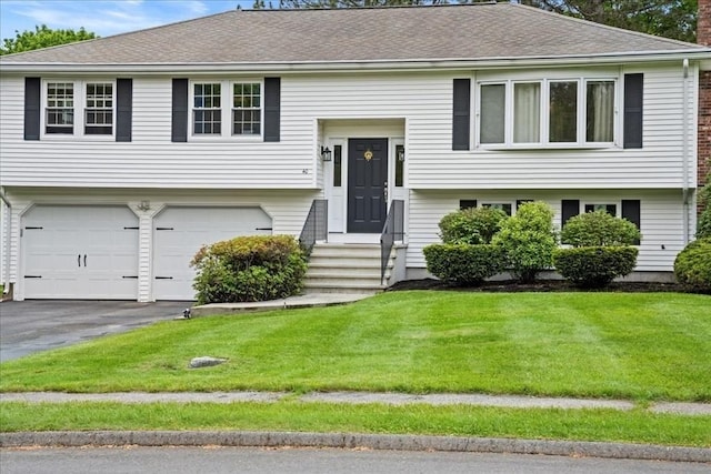 40 Richard Ave, Shrewsbury, MA 01545 - split foyer home with an attached garage, a front lawn, driveway, entry steps, and roof with shingles