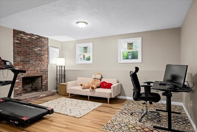 40 Richard Ave, Shrewsbury, MA 01545 - office space featuring wood finished floors, baseboards, and a fireplace