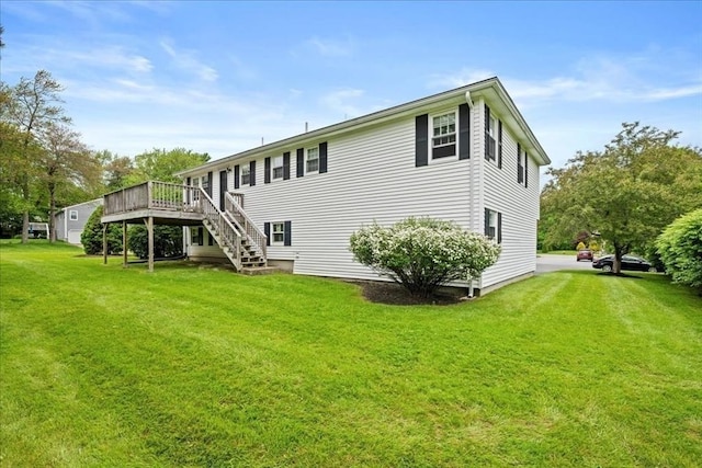 40 Richard Ave, Shrewsbury, MA 01545 - back of property featuring a wooden deck, a yard, and stairway