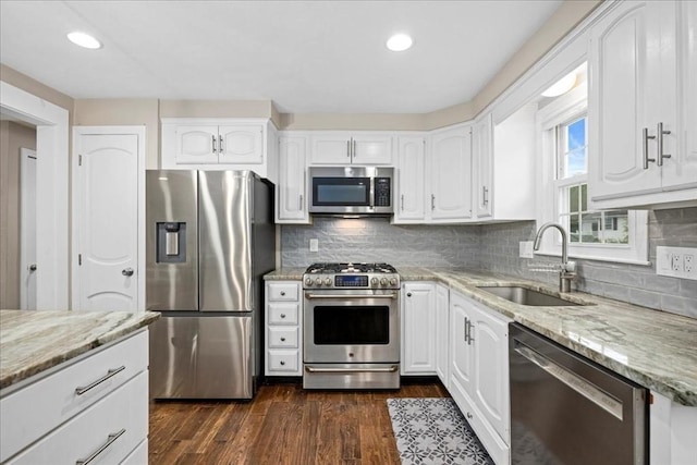 40 Richard Ave, Shrewsbury, MA 01545 - kitchen with appliances with stainless steel finishes, a sink, light stone counters, white cabinets, and recessed lighting