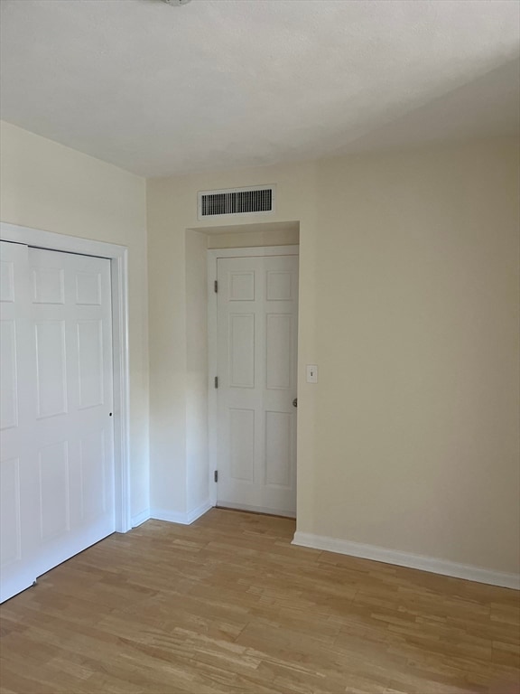 unfurnished room featuring light hardwood / wood-style flooring