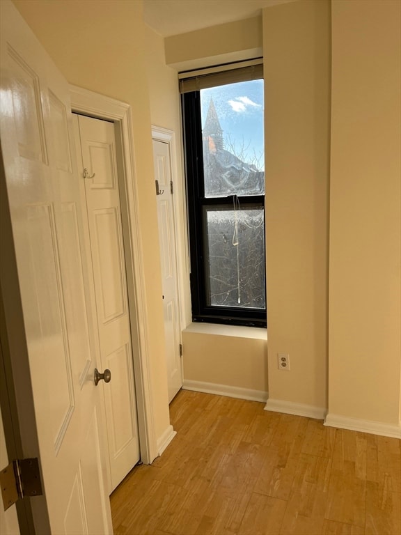 unfurnished room featuring light wood-type flooring