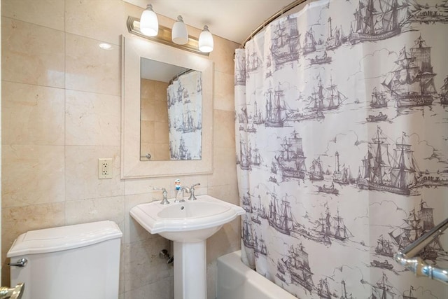 8 Whittier Pl Unit 17E, Boston, MA 02114 - bathroom with tile walls, shower / bathtub combination with curtain, and toilet