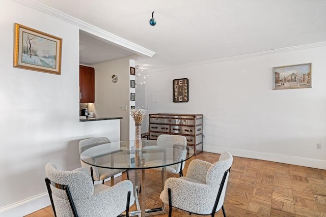 8 Whittier Pl Unit 17E, Boston, MA 02114 - dining room featuring baseboards and ornamental molding