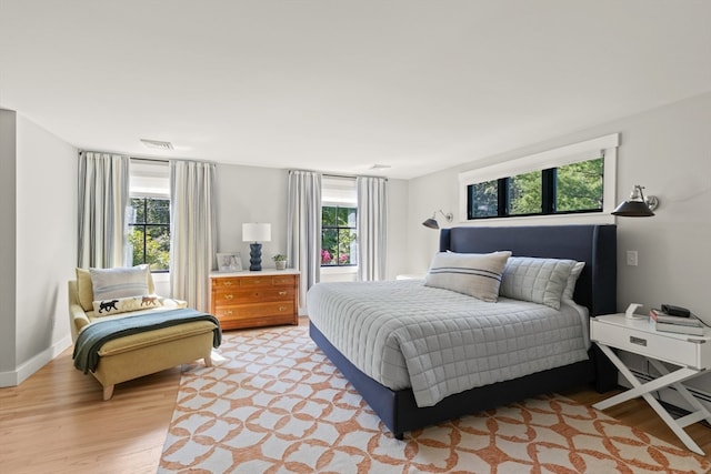 bedroom with light wood-type flooring