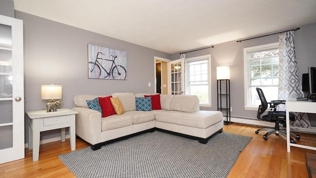 36 Jean Dr, North Attleboro, MA 02760 - living room featuring light wood-type flooring, a desk, and a baseboard radiator