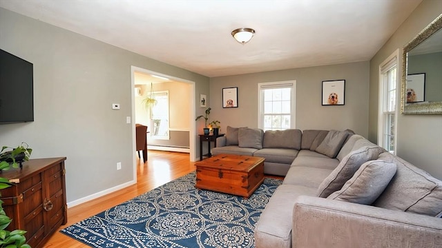 36 Jean Dr, North Attleboro, MA 02760 - living room featuring a baseboard heating unit, light wood-type flooring, and baseboards