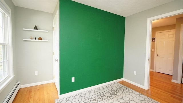 36 Jean Dr, North Attleboro, MA 02760 - unfurnished bedroom featuring baseboard heating, light wood finished floors, and multiple windows