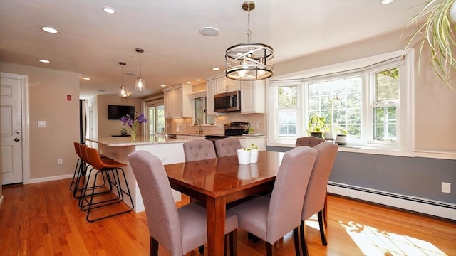 36 Jean Dr, North Attleboro, MA 02760 - dining space with a baseboard heating unit, recessed lighting, light wood-style floors, baseboards, and a chandelier