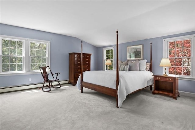 carpeted bedroom featuring baseboards, lofted ceiling, and a baseboard radiator
