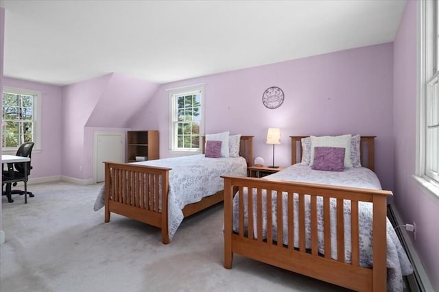 carpeted bedroom featuring baseboards, multiple windows, and a baseboard heating unit