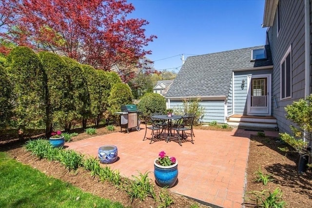 view of patio featuring a grill
