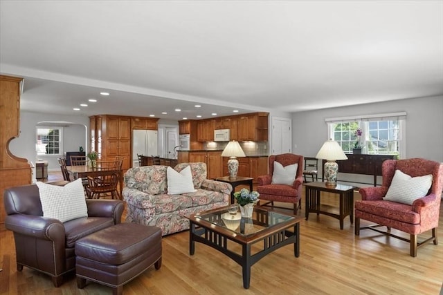 living room with recessed lighting and light wood-type flooring