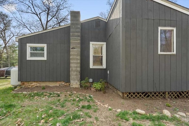 view of home's exterior featuring a chimney