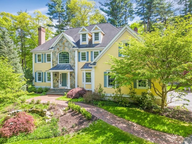 10 Whitney Rd, Stow, MA 01775 - view of front facade with a chimney and stone siding