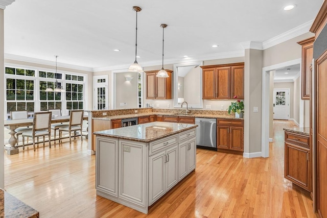 10 Whitney Rd, Stow, MA 01775 - kitchen featuring stainless steel dishwasher, a sink, brown cabinetry, light wood-type flooring, and ornamental molding
