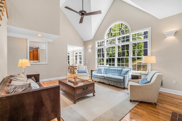 10 Whitney Rd, Stow, MA 01775 - living room with a ceiling fan, high vaulted ceiling, wood finished floors, and baseboards