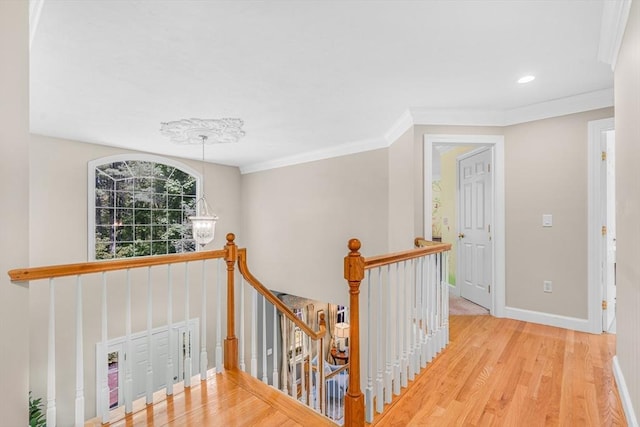 10 Whitney Rd, Stow, MA 01775 - hallway featuring an upstairs landing, wood finished floors, baseboards, ornamental molding, and a chandelier