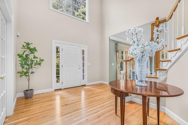 10 Whitney Rd, Stow, MA 01775 - foyer entrance with stairway, wood finished floors, baseboards, and a towering ceiling