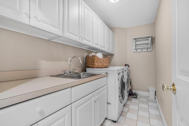 10 Whitney Rd, Stow, MA 01775 - laundry area with cabinet space, washer and dryer, baseboards, and light tile patterned flooring