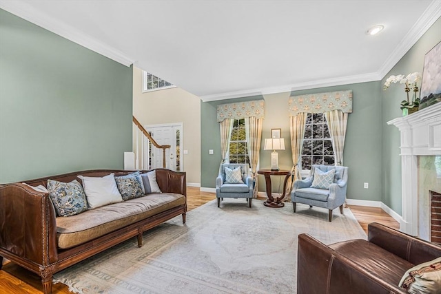 10 Whitney Rd, Stow, MA 01775 - living room with stairs, healthy amount of natural light, crown molding, a premium fireplace, and baseboards