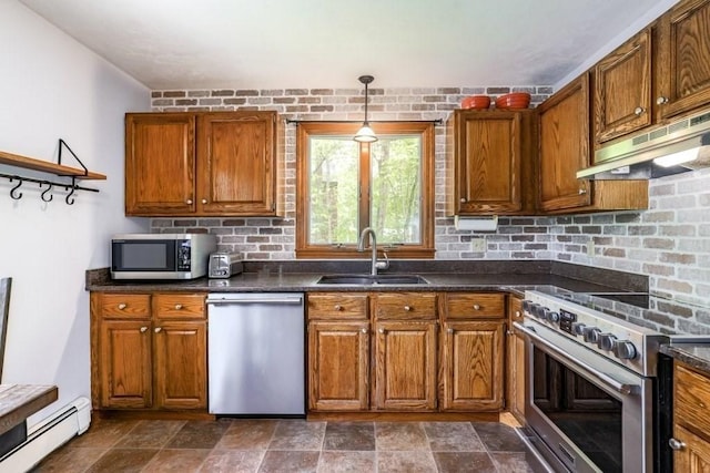 83 Everett Rd, Barre, MA 01005 - kitchen featuring appliances with stainless steel finishes, a baseboard radiator, a sink, under cabinet range hood, and dark countertops