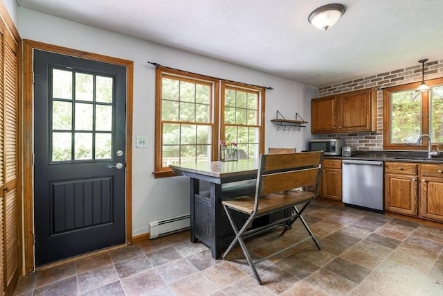 83 Everett Rd, Barre, MA 01005 - kitchen with stainless steel appliances, a sink, stone tile floors, and brown cabinetry