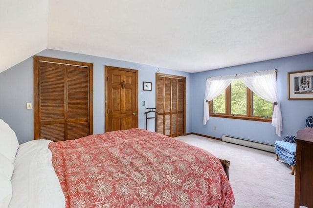 83 Everett Rd, Barre, MA 01005 - bedroom with a baseboard radiator, light colored carpet, multiple closets, and vaulted ceiling