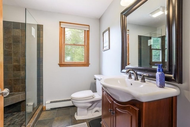 83 Everett Rd, Barre, MA 01005 - bathroom with a baseboard radiator, toilet, vanity, a stall shower, and baseboards