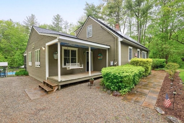 83 Everett Rd, Barre, MA 01005 - view of front of house featuring a chimney and covered porch