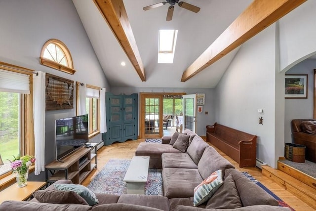 83 Everett Rd, Barre, MA 01005 - living area with ceiling fan, light wood-type flooring, beamed ceiling, a skylight, and arched walkways