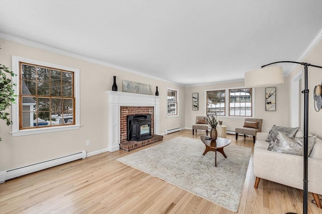 living area featuring a baseboard radiator, a baseboard heating unit, wood finished floors, baseboards, and crown molding