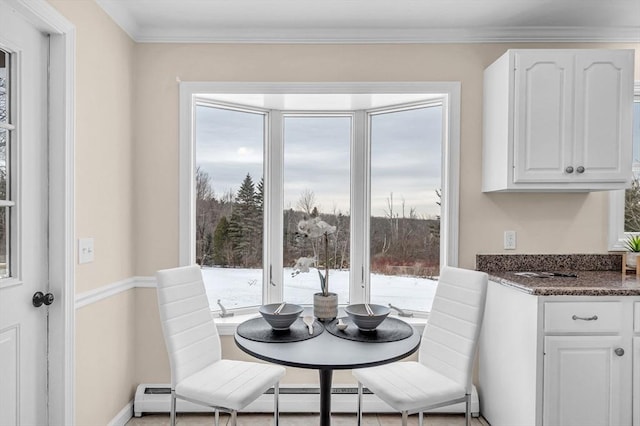 dining area with ornamental molding and a baseboard radiator