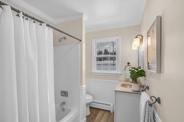 full bath featuring toilet, wood finished floors, vanity, baseboard heating, and crown molding