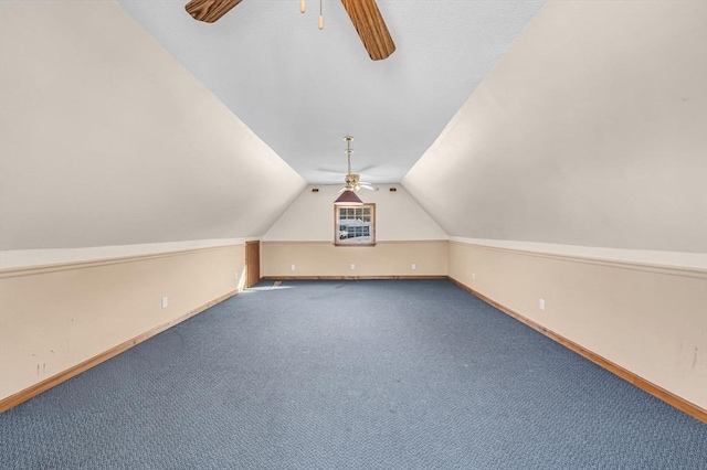 additional living space with lofted ceiling, ceiling fan, baseboards, and carpet flooring