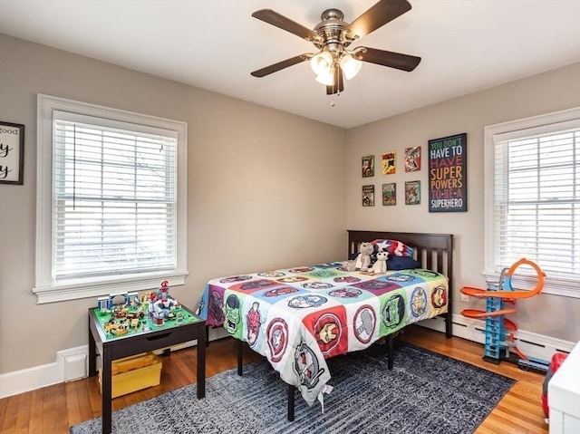 bedroom featuring hardwood / wood-style flooring and ceiling fan