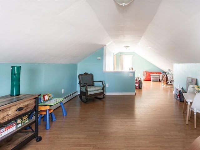 recreation room featuring hardwood / wood-style flooring and vaulted ceiling