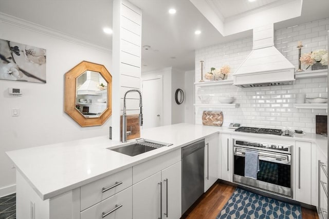 500 Atlantic Ave Unit 15M, Boston, MA 02110 - kitchen with appliances with stainless steel finishes, custom range hood, ornamental molding, open shelves, and tasteful backsplash